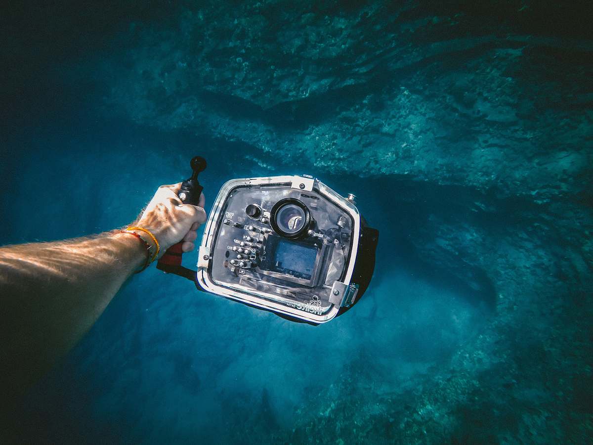 underwater video person holding underwater camera underwater photography